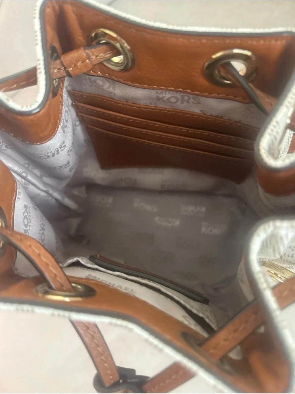 Michael Kors Cream Logo Drawstring Crossbody with Brown Trim and Gold Hardware